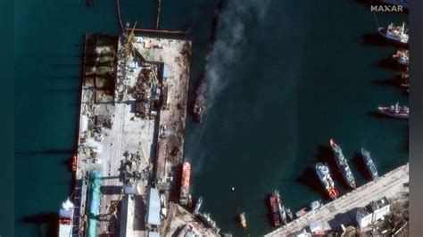 Satellite images show Russian navy ship burning after Ukrainian strike in Crimea